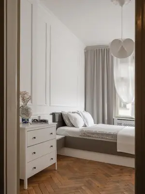 a bedroom with a bed and a dresser and a window at Airstay Prague : DeLuxe Apartment Old town in Prague