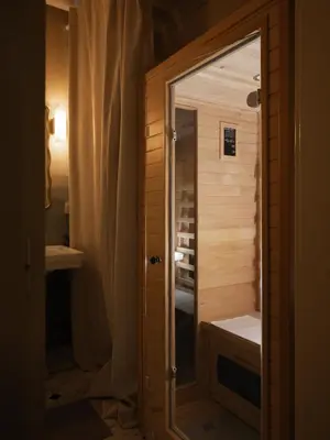 a shower with a glass door in a bathroom at Airstay Prague : DeLuxe Apartment Old town in Prague