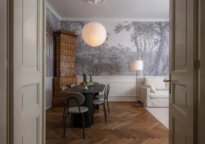 a dining room with a table and chairs at Airstay Prague : DeLuxe Apartment Old town in Prague