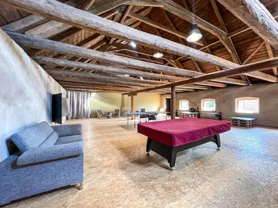 a living room with a couch and a table at Pivovar Mlýn in Štětí