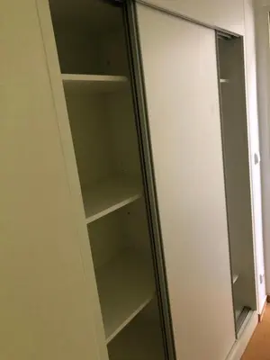 a glass cabinet with empty shelves in a room at Klidné místo v Měsíčním údolí Poříčí nad Sázavou in Poříčí nad Sázavou