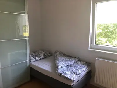 a small room with two pillows sitting on a bench at Klidné místo v Měsíčním údolí Poříčí nad Sázavou in Poříčí nad Sázavou