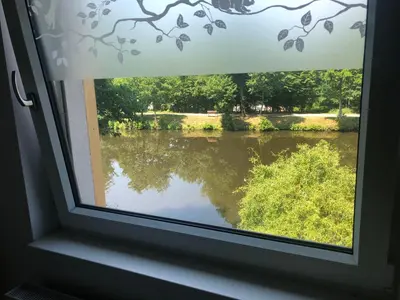 a window with a view of a river at Klidné místo v Měsíčním údolí Poříčí nad Sázavou in Poříčí nad Sázavou