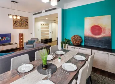 a dining room with a table and chairs at VN3 Terraces Suites by Adrez in Prague