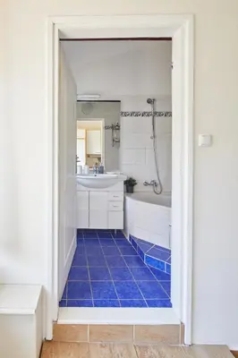a room with a desk with potted plants on it at Prague Days - Open-plan Duplex with Corner Bath and Netflix in Vinohrady in Prague