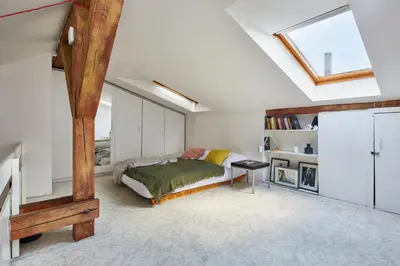 a bathroom with a tub and a sink and a mirror at Prague Days - Open-plan Duplex with Corner Bath and Netflix in Vinohrady in Prague
