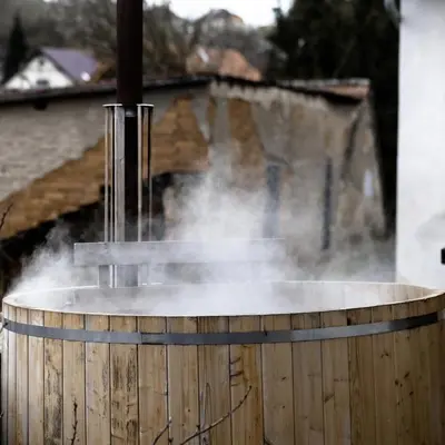 a barrel with smoke coming out of it at Apartmány pod Kozákem in Velké Popovice
