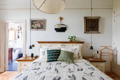 a bedroom with a bed with white sheets and pillows at Victoria Design Stays - Premium Apartment Ohrada in Prague