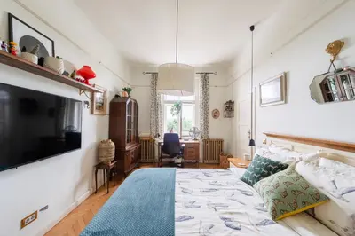 a bedroom with a bed and a flat screen tv at Victoria Design Stays - Premium Apartment Ohrada in Prague