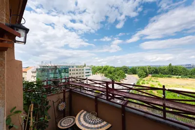 a balcony with a view of a city at Victoria Design Stays - Premium Apartment Ohrada in Prague
