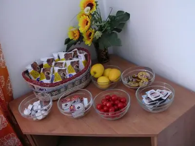 a table with bowls of food and baskets of fruit at Penzion Dana Troja in Prague