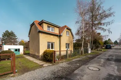 a house on the side of a street at Apartmány Jevany in Jevany