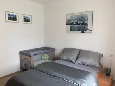 a bedroom with a bed and a sink in it at Apartmány Jevany in Jevany