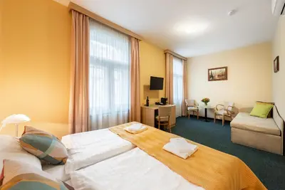 a hotel room with a large bed in a room at Hotel Libero in Prague