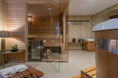 a bathroom with a tub and a sink and a toilet at Zámecký hotel & Wellness in Poděbrady