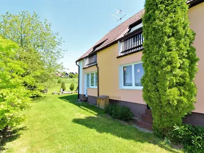 a house with a green yard in front of it at Apartment Rabyně-2 by Interhome in Rabyně