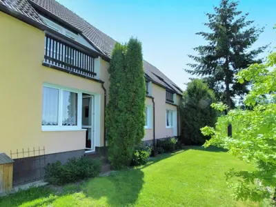 a house with a green yard in front of it at Apartment Rabyně-2 by Interhome in Rabyně