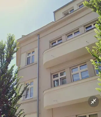 a building with windows on the side of it at Walter&Sons Apartment Centro in Poděbrady