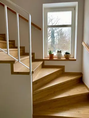 a staircase in a house with a window at Dobré časy Apartment in Poděbrady