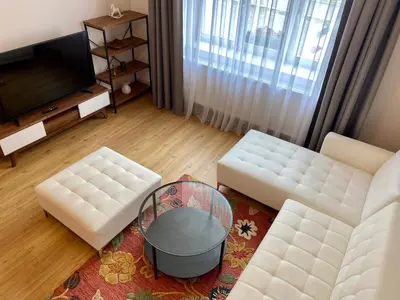 a living room with a couch and a table at Dobré časy Apartment in Poděbrady
