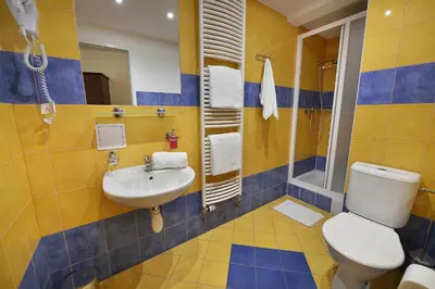 a bathroom with a toilet and a sink at Prague Season Hotel in Prague