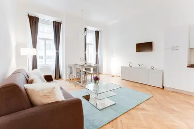 a living room with a couch and a table at Wenceslass Square Royal Residence Apartments in Prague