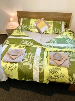 two beds with towels on top of them at Penzion Villa Amélie in Mladá Boleslav
