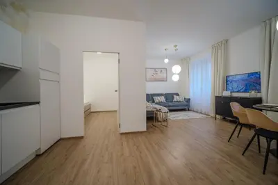 a living room with a couch and a table at Apartmán v srdci Prahy in Prague