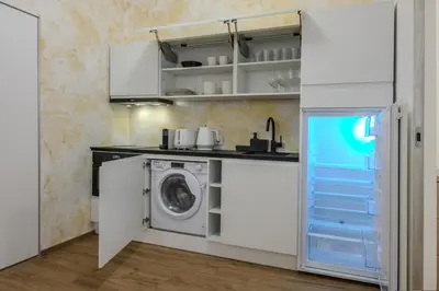 a laundry room with a washer and dryer at Apartmán v srdci Prahy in Prague
