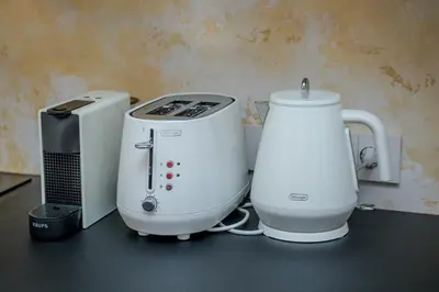 two appliances sitting on a counter next to a printer at Apartmán v srdci Prahy in Prague