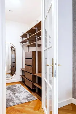 a room with a closet with wooden shelves at Luxury apartments in the city centre in Prague
