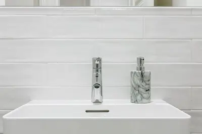 a bathroom sink with a faucet on top of it at Luxury apartments in the city centre in Prague