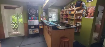 a shop with a counter and a refrigerator at Bungalov Silvie in Litoměřice