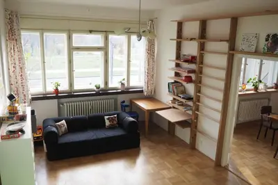 a living room with a couch and a table at Rodinný apartmán v centru Prahy in Prague