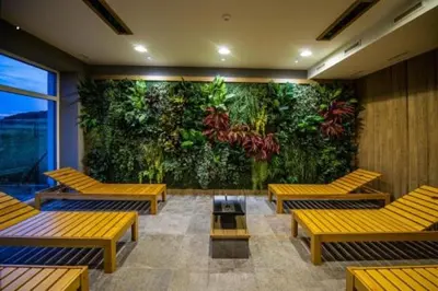 a room with benches and a wall with a mural at Hotel Berounka in Hřebečníky