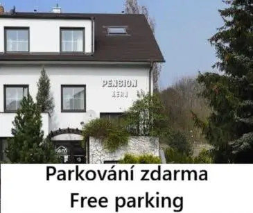 a large white building with the words parkowment zaporinia free parking at Pension Kern in Prague