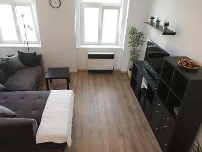 a living room with a couch and a table at Fine apartment in centrum of Slaný with Aircondition in Slaný