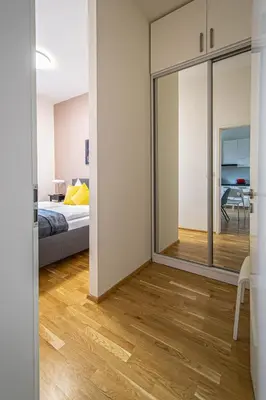 a bedroom with a bed and a sliding glass door at Stylish apartment in Prague best gastronomic area in Prague