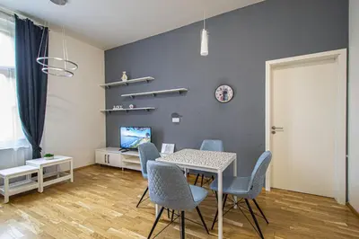 a dining room with a table and chairs at Stylish apartment in Prague best gastronomic area in Prague