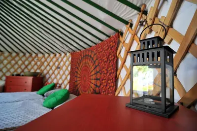 a lantern sitting on a table in a tent at Jurty v Sadu in Český Brod