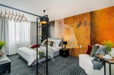 a bedroom with a bed and a couch in a room at Romantic Apts Prague by Michal&Friends in Prague