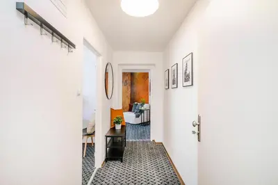a hallway with white walls and a white door at Romantic Apts Prague by Michal&Friends in Prague