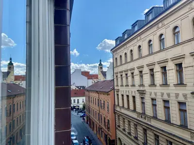 a view of a city street from a window at Lokal apartment in Prague
