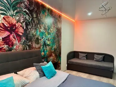 a bedroom with a bed and a painting on the wall at Lokal apartment in Prague