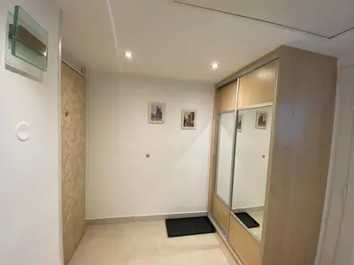 a room with a glass partition and a walk in closet at Apartman Xaveriova in Prague