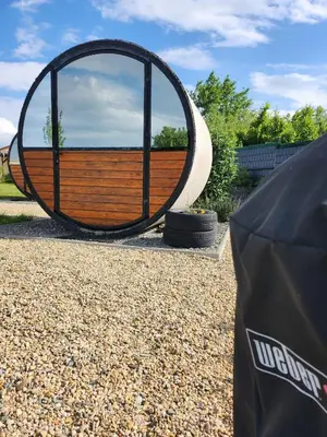 a large mirror sitting next to a car at RIP by Říp in Krabčice