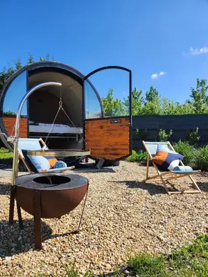 a couple of chairs and a dome tent with a mirror at RIP by Říp in Krabčice