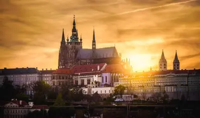 a large building with towers on a city skyline at Triplex Kings Apartment in Old Town in Prague