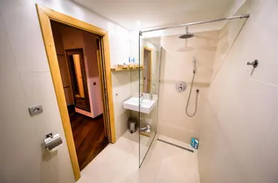 a bathroom with a shower and a sink at Triplex Kings Apartment in Old Town in Prague