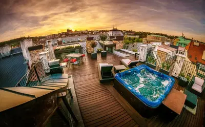 a hot tub on the deck of a cruise ship at Triplex Kings Apartment in Old Town in Prague